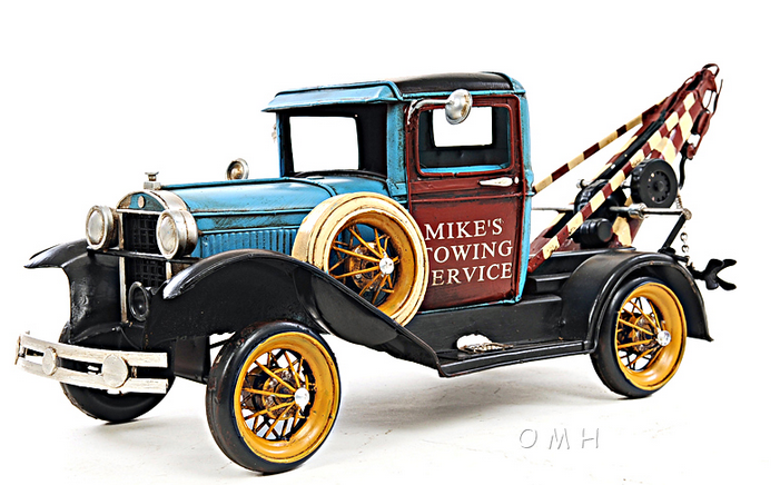 1:12 scale vintage tow truck model in blue and black with gold wheels and tow boom