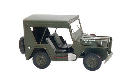 Olive-green vintage jeep model with open cab and canvas top, front grille visible
