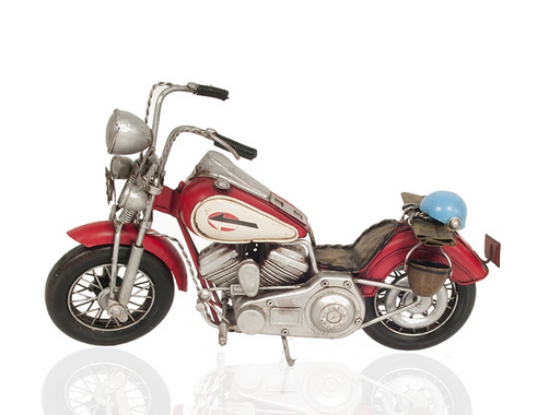 Red metal Harley-Davidson model motorcycle with cream graphics and chrome engine