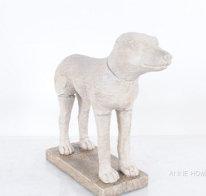 Stone-finish dog statue, standing with head raised on rectangular base