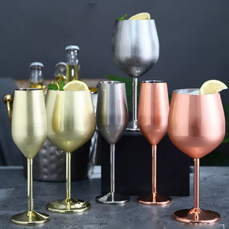 Metallic champagne cocktail glasses set with gold, silver, and rose flutes
