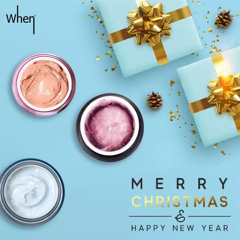Three mask jars with peach, purple, and white creams next to gift bows