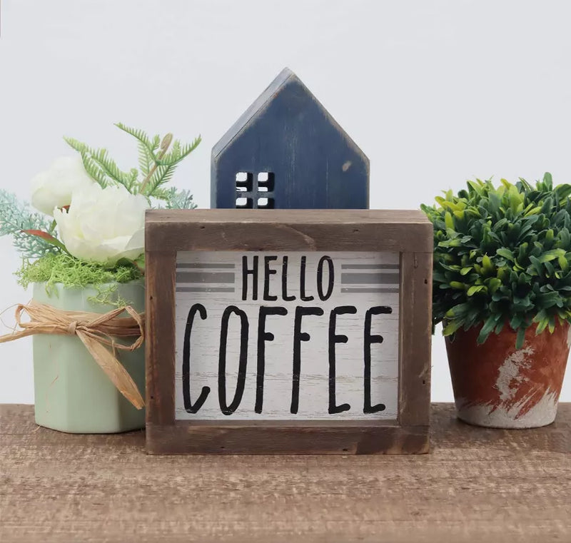 Wooden freestanding box sign reading “HELLO COFFEE” with distressed brown frame