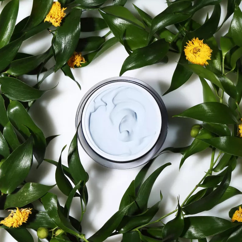 When Creamy Mud mask jar with white cream inside, open lid close-up