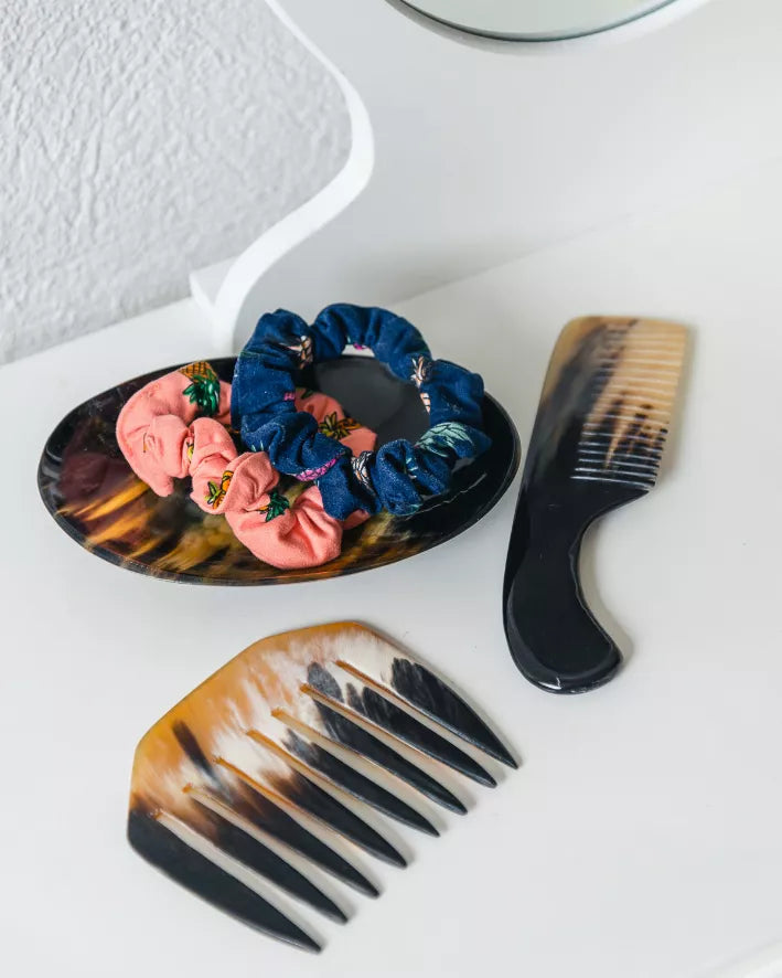 Round horn dish with marbled multicolor floral pattern and scalloped rim