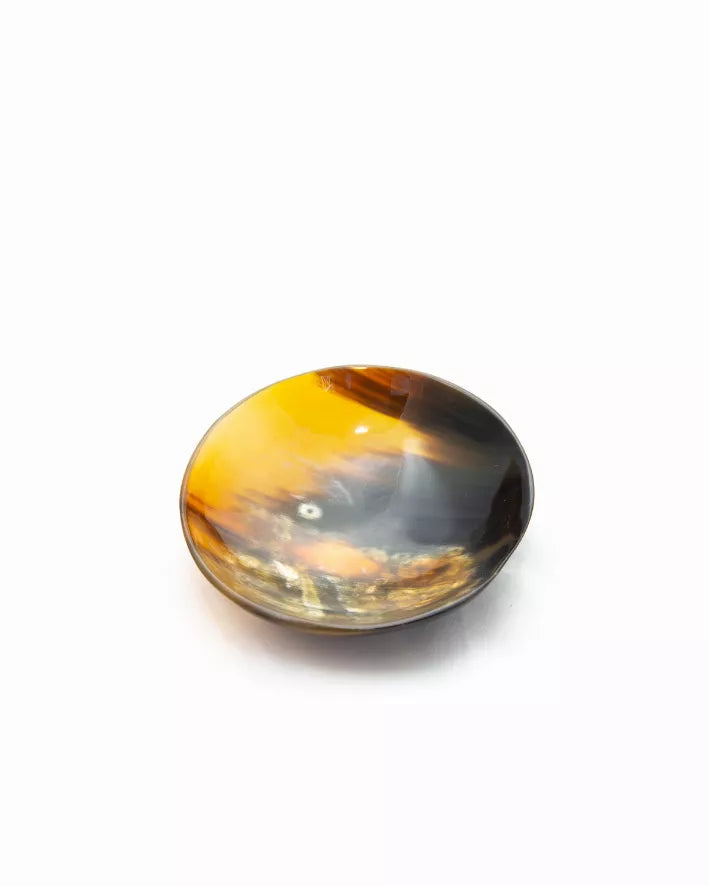 Round horn dish with yellow-brown mottled finish and glossy interior