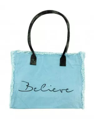 Light blue tote bag with black handles and 'Believe' cursive front print