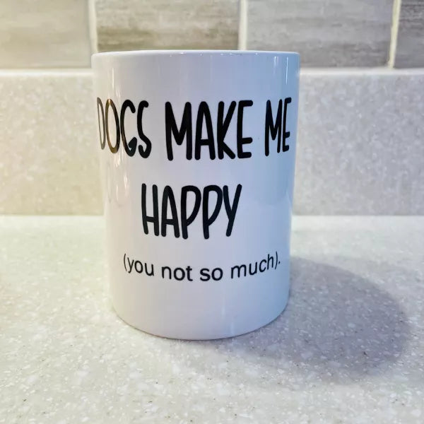 White 15 oz coffee mug with black "Dogs Make Me Happy" text