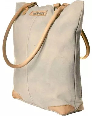 Tan canvas tote bag with brown leather handles and front panel detail