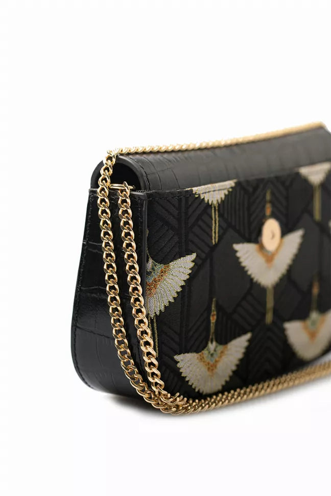 Black patterned flap chain bag with gold chain and wing motifs