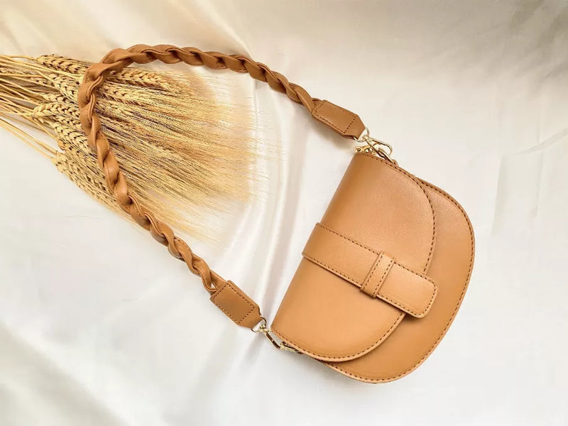 Hallie shoulder bag with braided strap, flap closure, and small front buckle tab