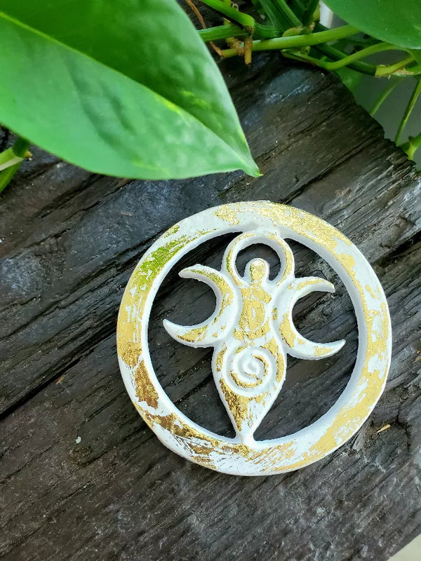 White and gold fertility goddess altar tile with circular peace-wheel symbol