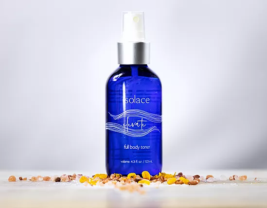 Blue toner bottle with spray pump and clear top