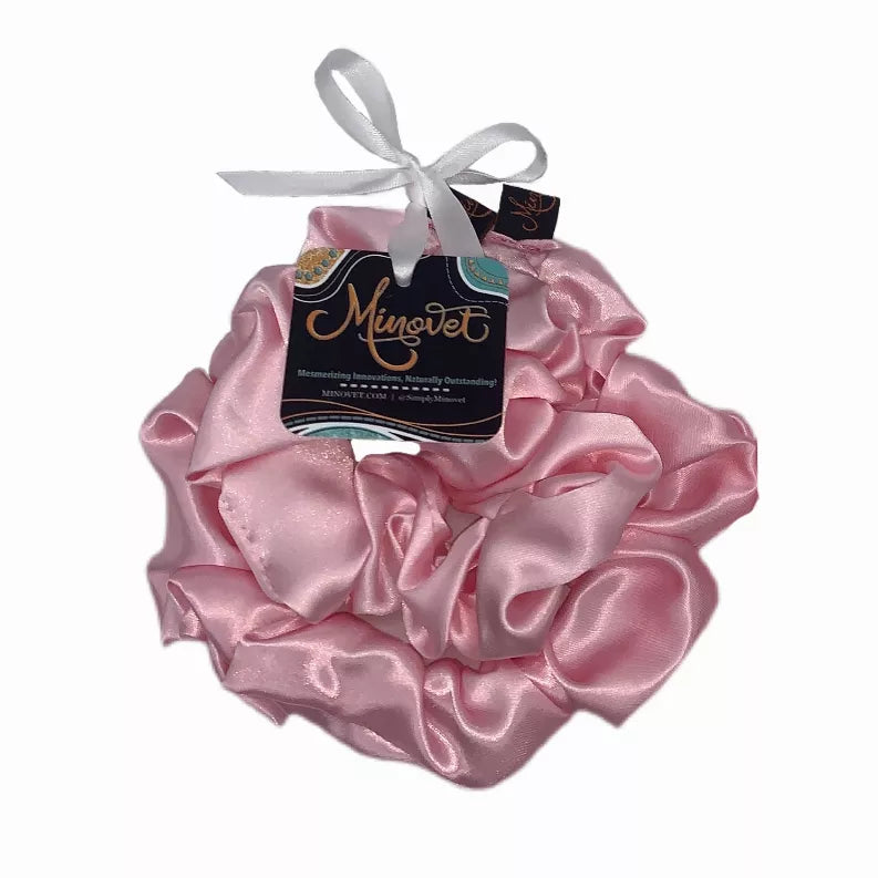 Pink satin scrunchie with gathered ruffle loops and satin bow fabric tag