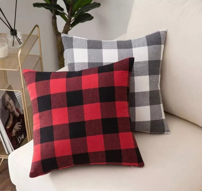 Red and black buffalo plaid throw pillow cover on couch, square stitched design