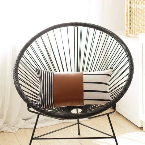 Brown striped faux leather throw pillow with geometric panel pattern