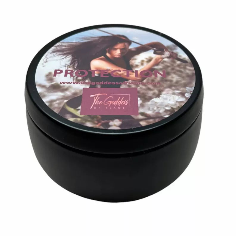 Black round candle tin with lid graphic and pink label; sealed top