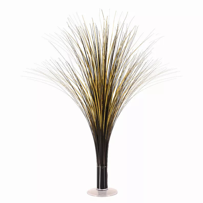 Metallic spray centerpiece with gold wire strands on black base and clear stand