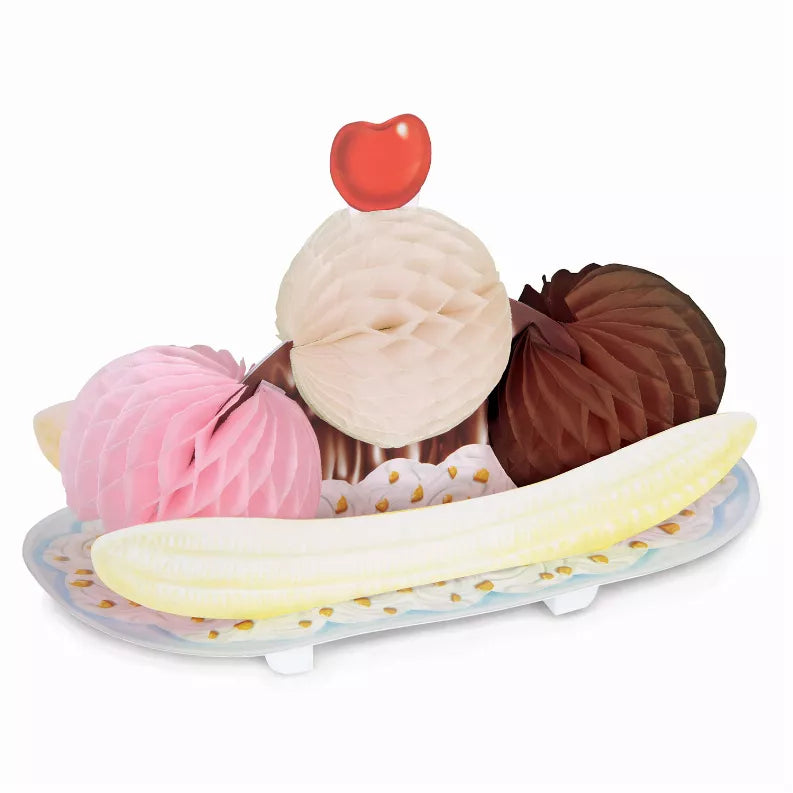 Assorted tissue decorations: pink, white, brown pom-poms on a yellow base