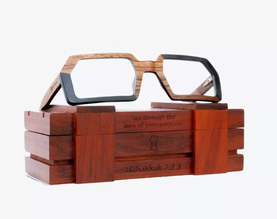 Square-frame eyeglasses in wooden case, light lenses and dark blue-tone frame
