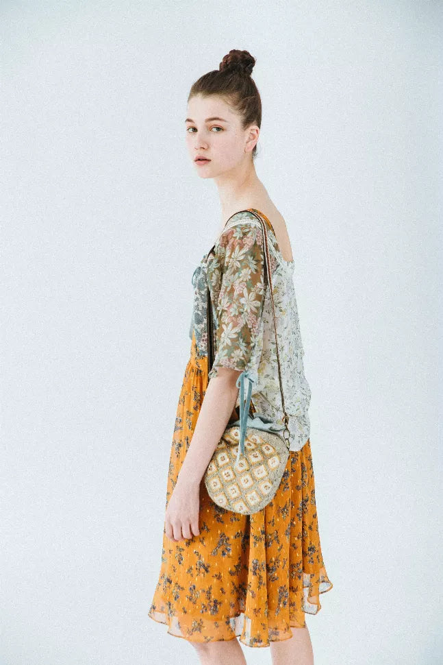 Floral kimono-style dress, orange and sage green print, gathered skirt, side view