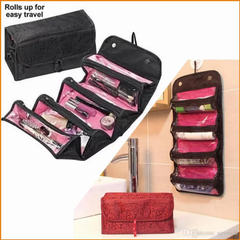 Black roll-up travel pouch with zipper compartments, folded open and hanging display