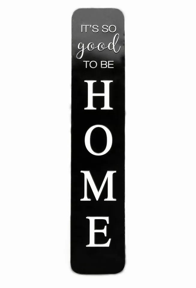 Black embossed metal wall sign with vertical “HOME” letters and “It’s so good”