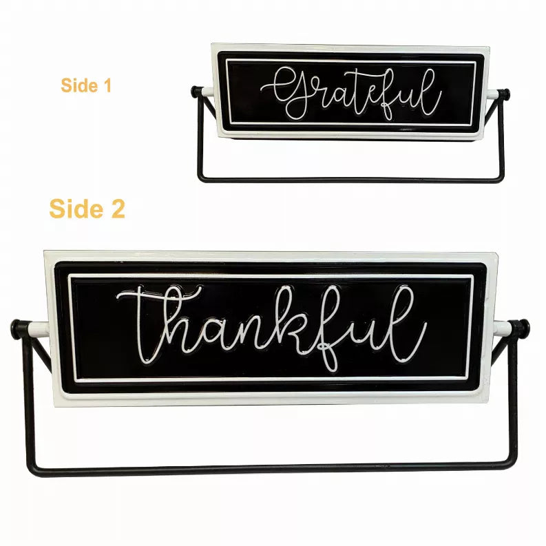 Rotating tabletop metal sign with black panel and white cursive 'Grateful' on black stand