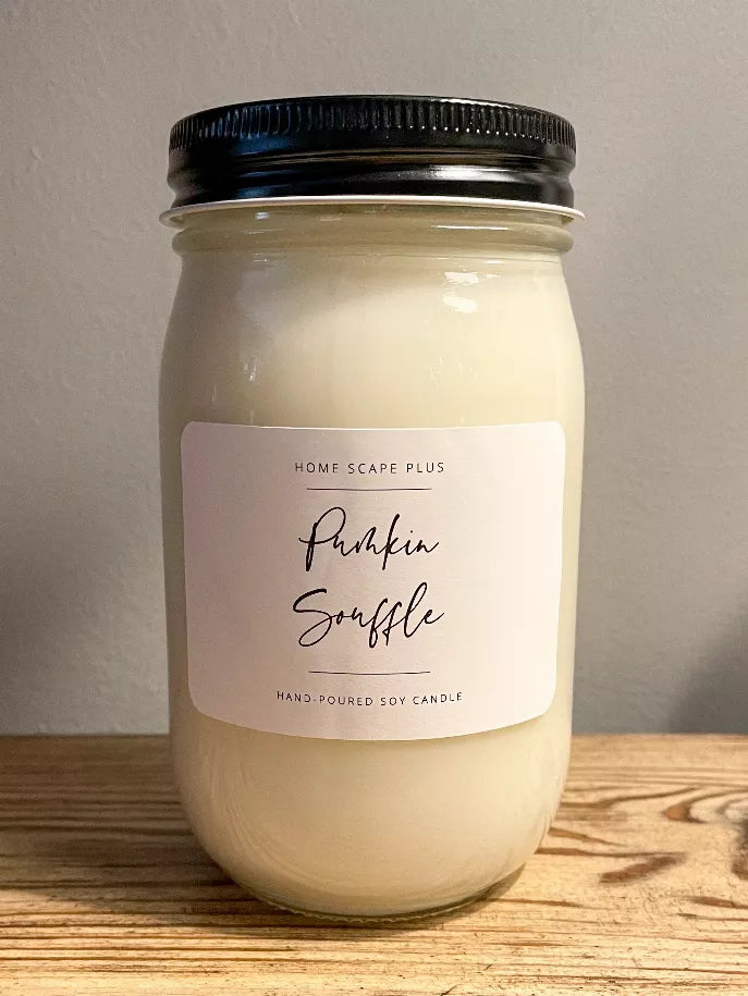 Soy candle in clear glass jar with black lid, Pumpkin Souffle label