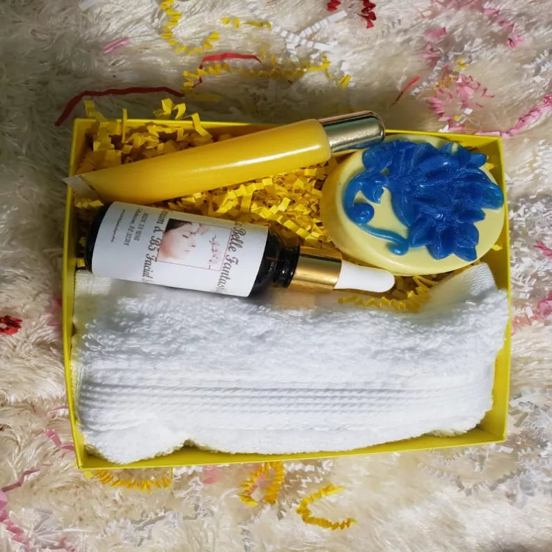 Hyaluronic acid serum gift set in yellow box with bottle, blue applicator, white cloth