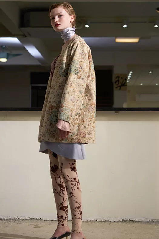 Sheer-chiffon leggings in light almond with dark branch print, angled full leg view