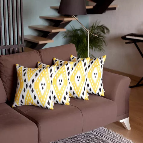 Set of 2 brown faux leather throw pillows with yellow diamond patterned covers