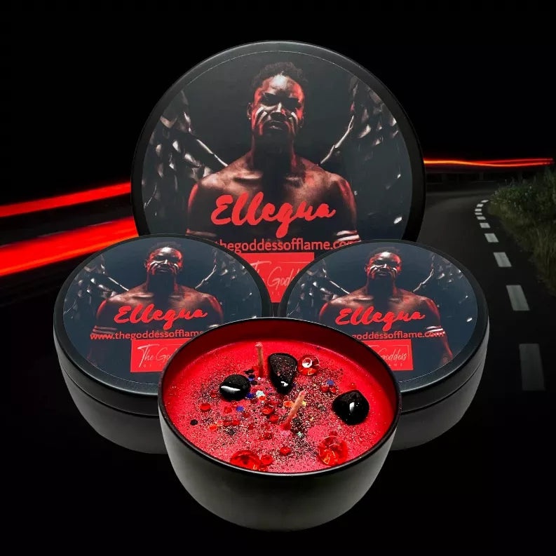 Elegua candle tins stacked; open top shows red wax with black stones and red beads
