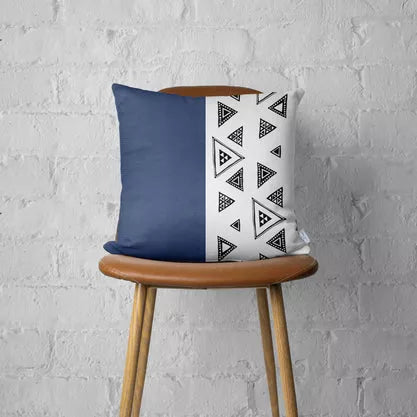 Navy faux leather throw pillow cover with white geometric pattern panel and tag