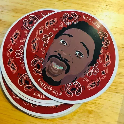 Close-up round sticker with illustrated bearded face, gold teeth, red paisley, R.I.P. ODB