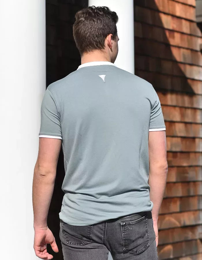 Short-sleeve notch-collar polo shirt, blue-gray with white trim, back view