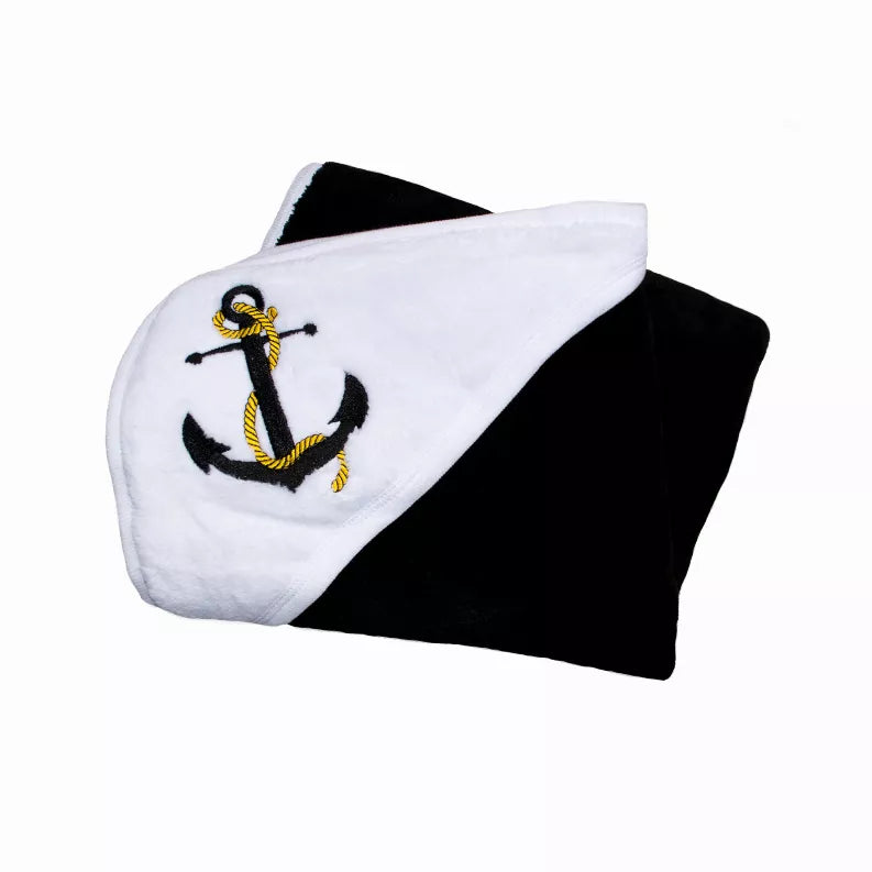 Plush baby blanket with black back, white front, and embroidered anchor
