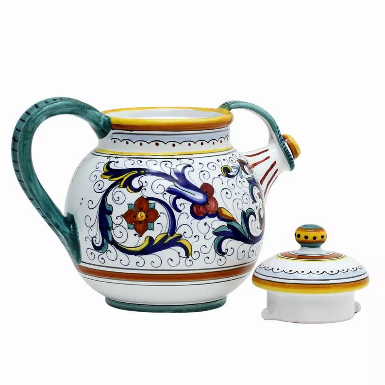 Ceramic teapot with blue-and-orange floral design, teal handle, plus matching lid