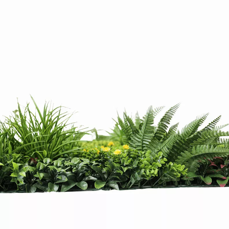 Artificial vertical garden wall panel with dense faux plants, grasses, and fern fronds