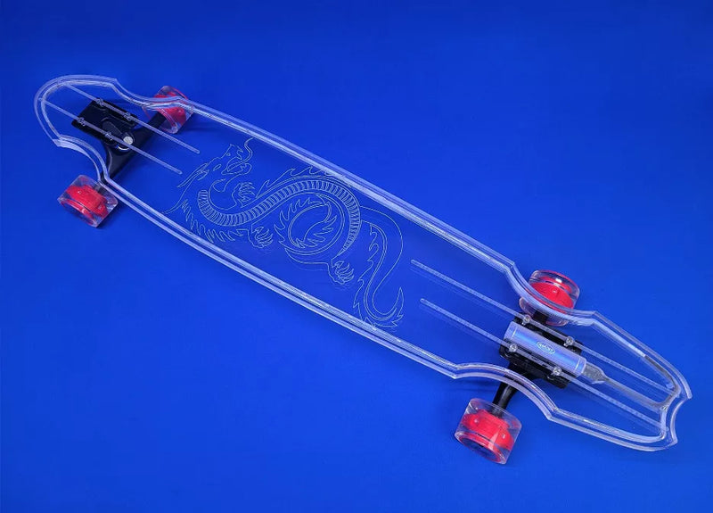 Clear skateboard deck with skeleton rose graphic, red wheels, angled view