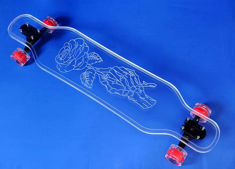 Clear skateboard with skeleton rose graphic, red wheels and black trucks