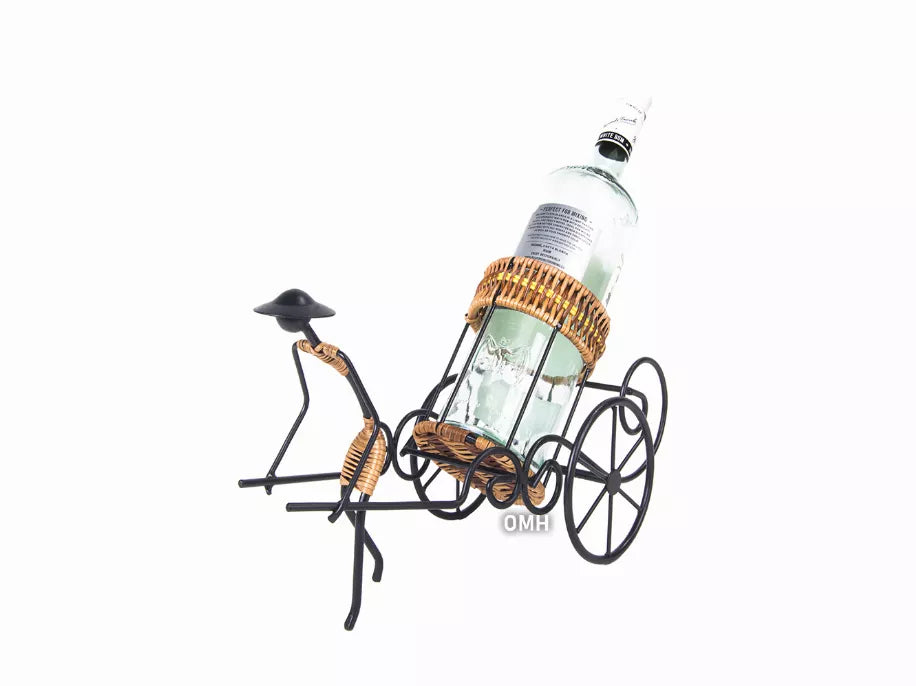 Wine bottle in rickshaw-style cart with wicker basket and black metal wheel frame