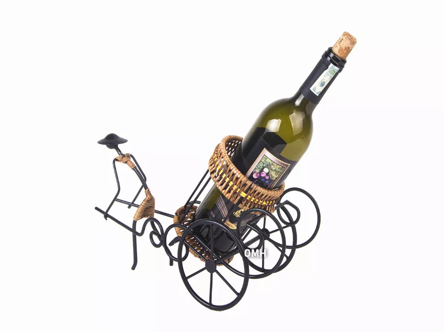 Wine bottle in rickshaw-style cart with wicker basket and ornate black wire wheels