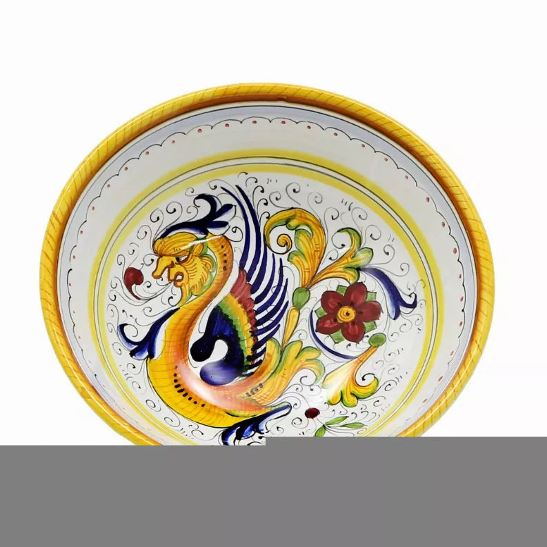 Pasta soup coupe bowl with yellow rim, white interior, blue and gold peacock center