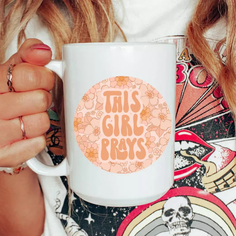 White ceramic coffee mug with 'This Girl Prays' floral circle print