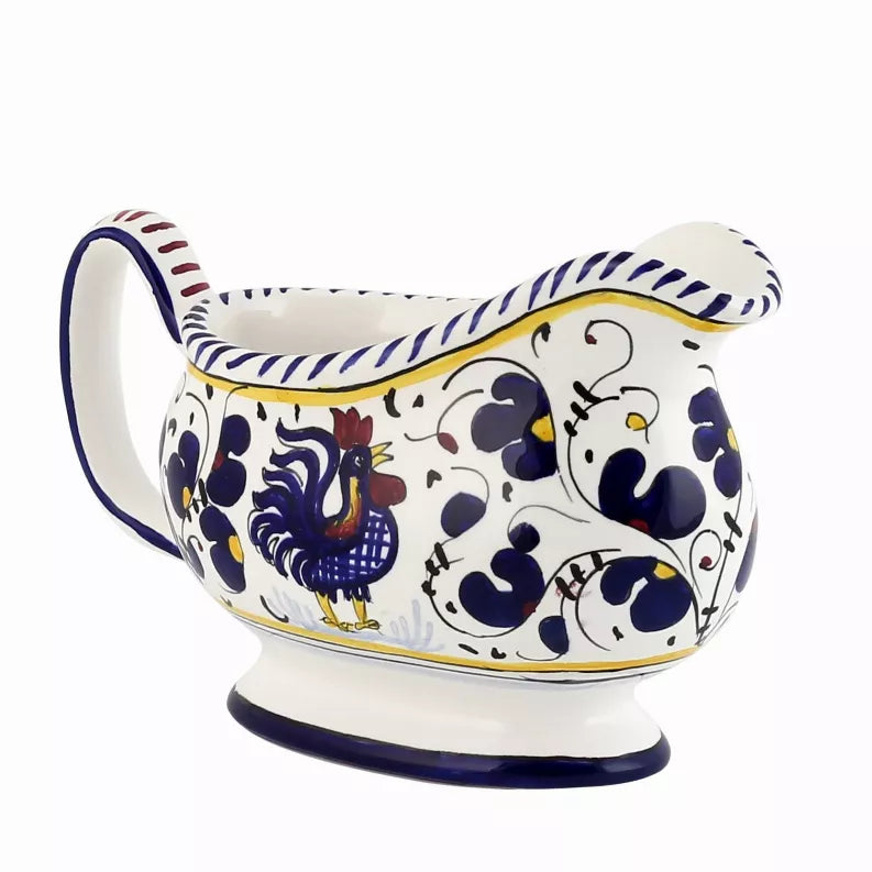Deruta-style ceramic sauce boat with blue rooster motif and scalloped rim