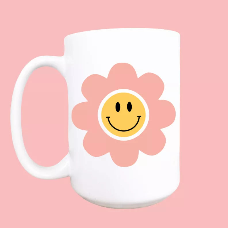 Happy daisy ceramic coffee mug, white with smiling flower face graphic and handle