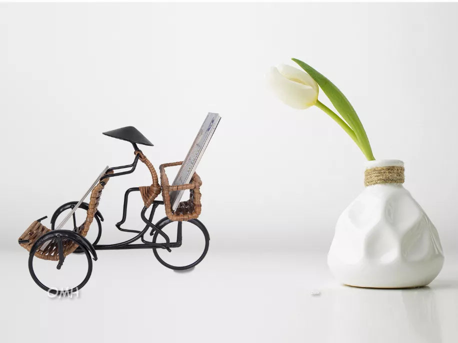 Woven rickshaw card holder with raised canopy and small wheel accents