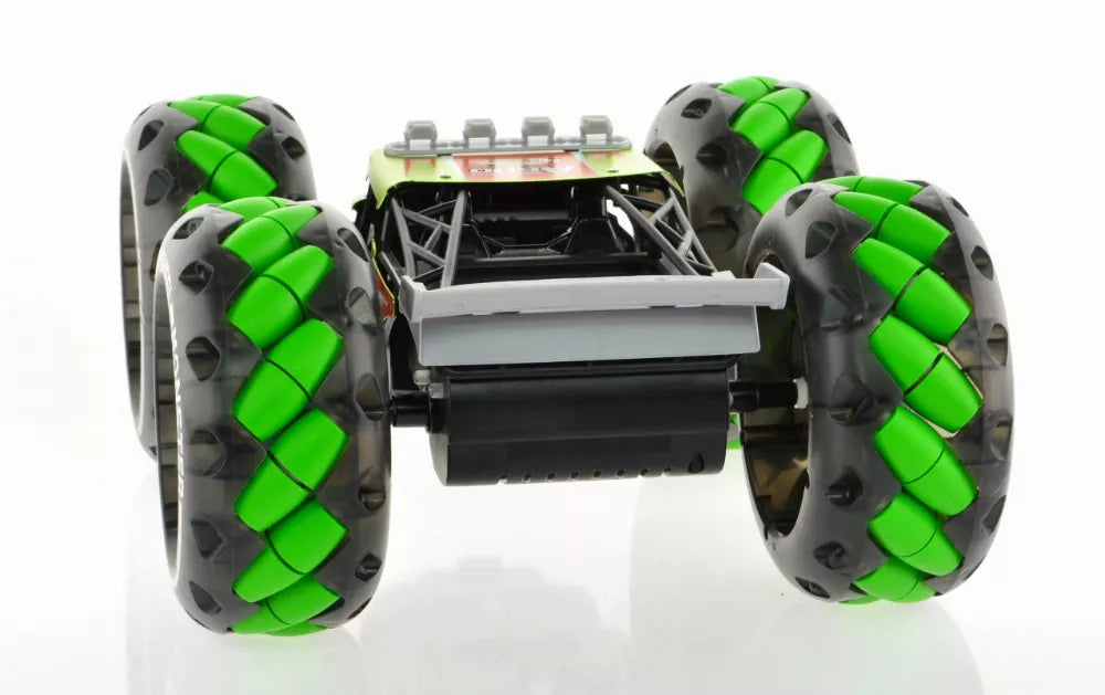 1:10 scale monster truck toy rear view with green segmented wheels and black bed