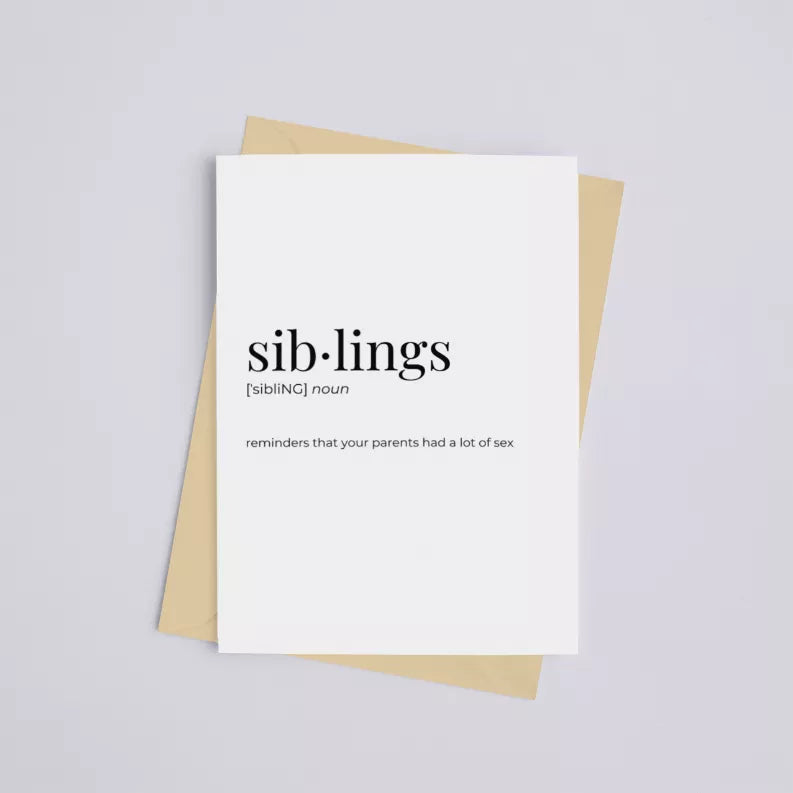White greeting card with 'sib-lings' text and definition, backed by kraft envelope